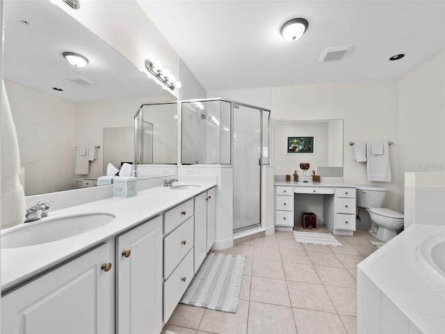 full bathroom with tile patterned floors, independent shower and bath, dual vanity, and toilet