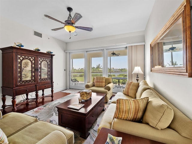 living room featuring ceiling fan and hardwood / wood-style floors