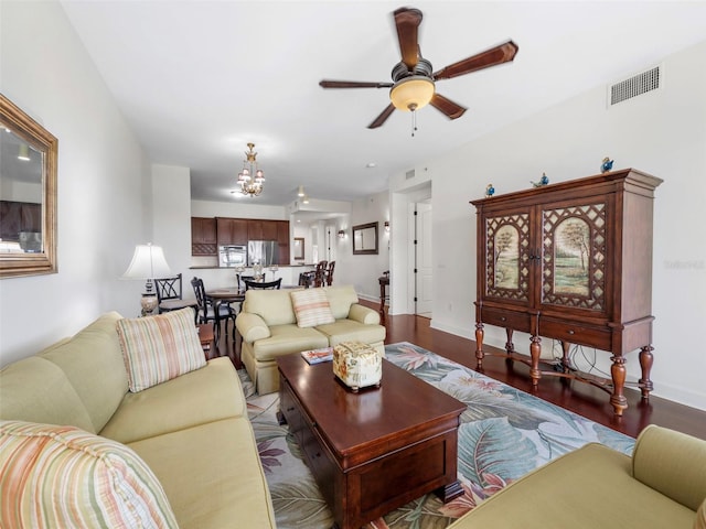 living room featuring hardwood / wood-style floors and ceiling fan