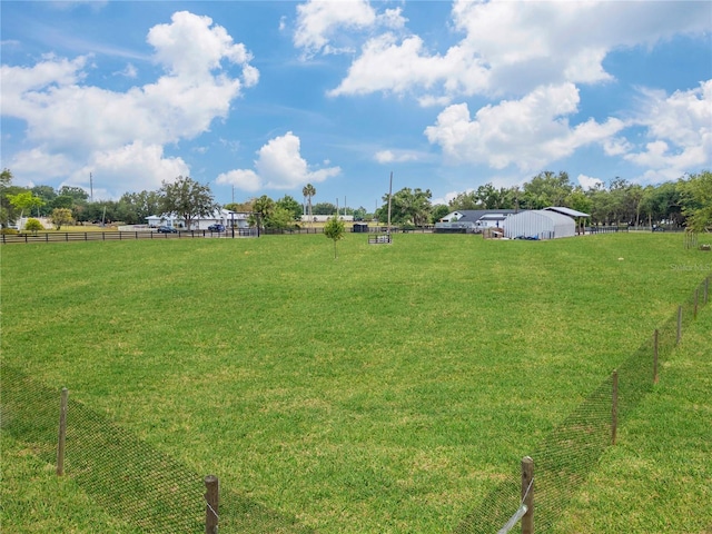 view of yard with a rural view