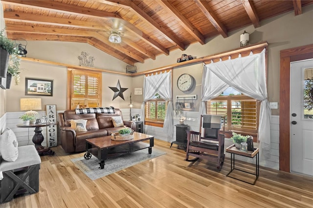 living room featuring high vaulted ceiling, beam ceiling, light hardwood / wood-style floors, and wood ceiling