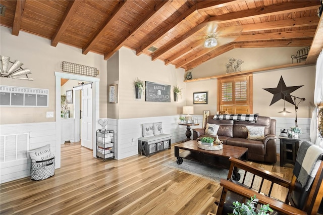 living room featuring ceiling fan, light hardwood / wood-style flooring, beamed ceiling, high vaulted ceiling, and wooden ceiling