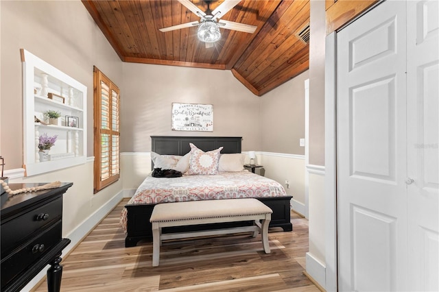 bedroom with lofted ceiling, wood ceiling, ceiling fan, and light hardwood / wood-style flooring