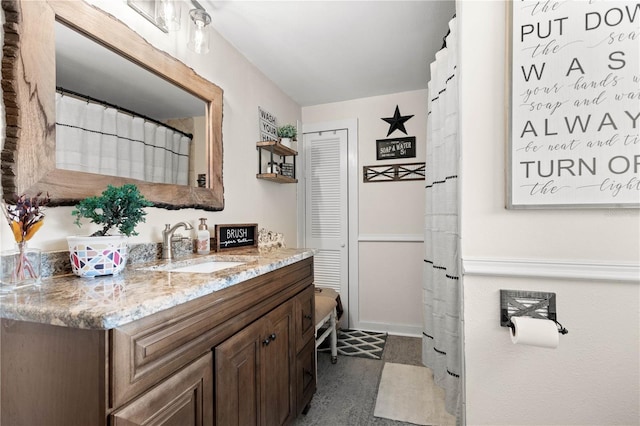 bathroom featuring vanity and tile floors