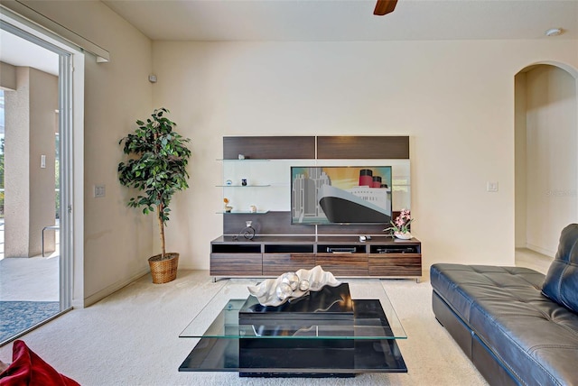 living room featuring light carpet and ceiling fan