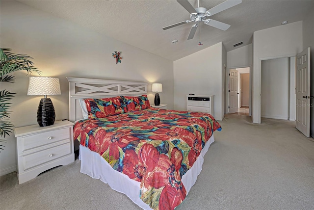 carpeted bedroom with ceiling fan and lofted ceiling