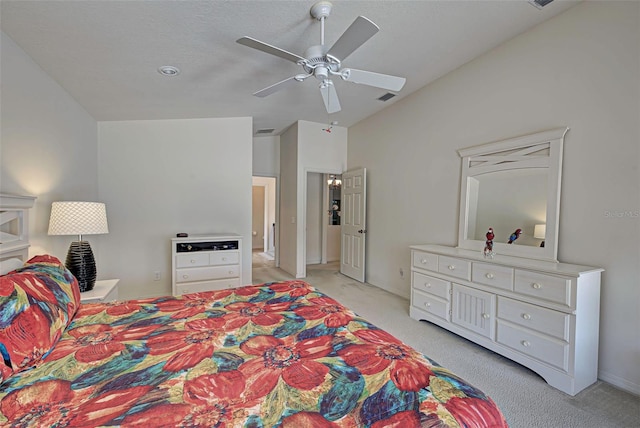 bedroom with ceiling fan and light colored carpet