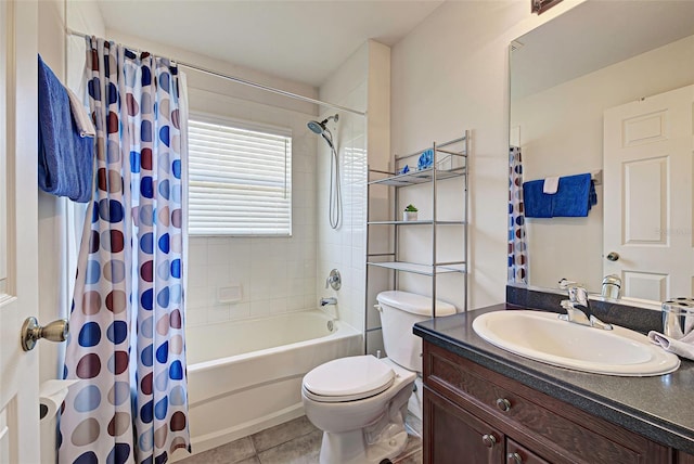 full bathroom featuring tile flooring, shower / bath combo with shower curtain, toilet, and vanity with extensive cabinet space