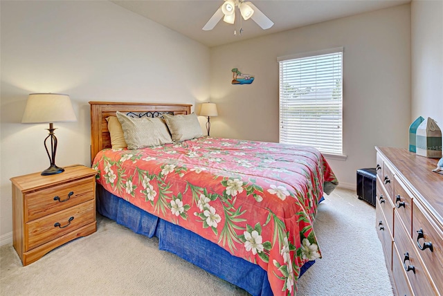 bedroom with light carpet and ceiling fan