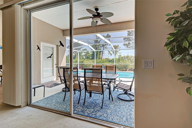 sunroom / solarium with ceiling fan