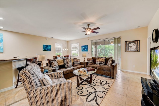 living room with ceiling fan and light tile floors