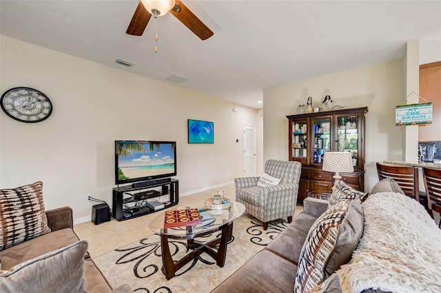 living room with ceiling fan and tile floors