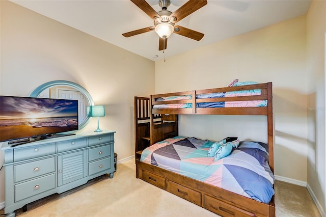 bedroom featuring light carpet and ceiling fan