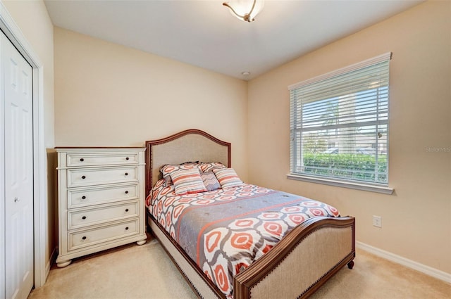 carpeted bedroom with a closet