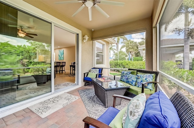 sunroom / solarium with ceiling fan