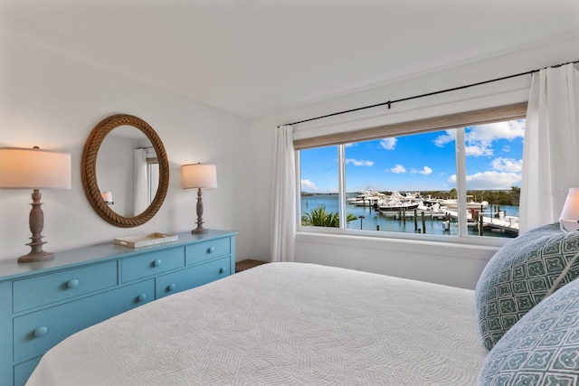 bedroom featuring a water view