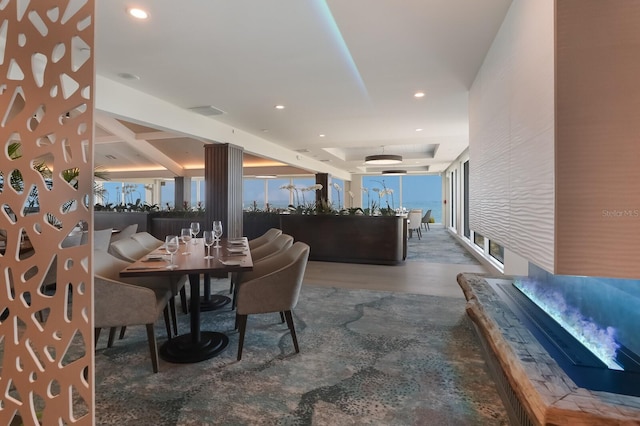 dining area with a tray ceiling