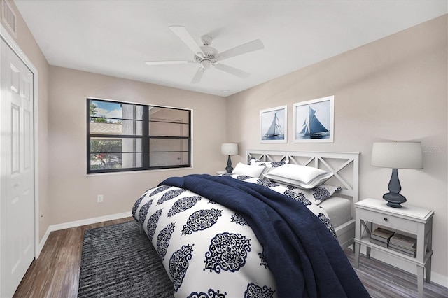 bedroom featuring a closet, ceiling fan, and dark hardwood / wood-style flooring