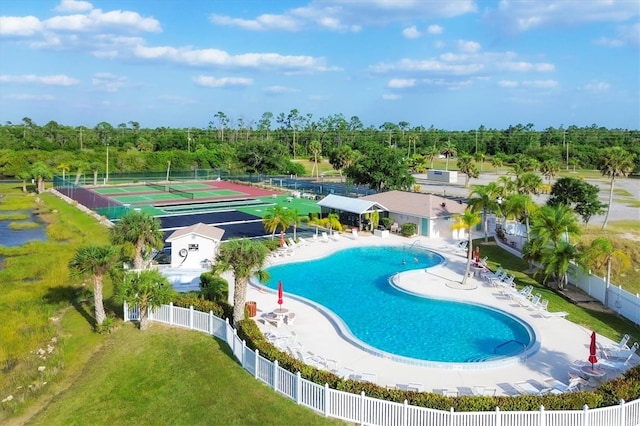 view of swimming pool featuring a lawn