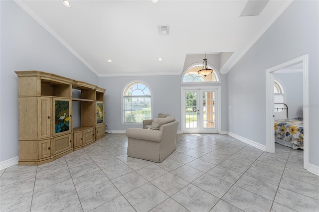 unfurnished room with french doors, high vaulted ceiling, and crown molding