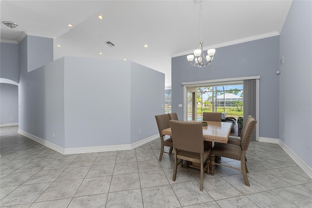 dining room with a notable chandelier, ornamental molding, and high vaulted ceiling