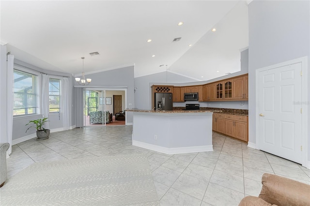 kitchen featuring stainless steel appliances, pendant lighting, a center island with sink, high vaulted ceiling, and an inviting chandelier