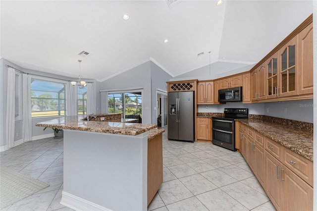 kitchen with stainless steel appliances, decorative light fixtures, lofted ceiling, a kitchen island with sink, and ornamental molding