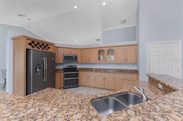 kitchen featuring stone counters, sink, crown molding, light tile patterned flooring, and stainless steel appliances