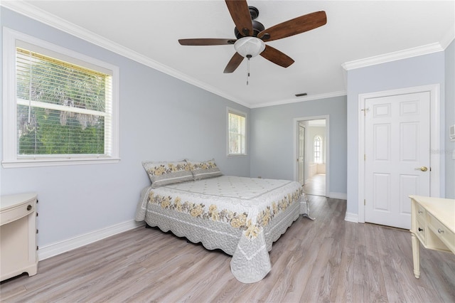 bedroom featuring light wood-type flooring, multiple windows, crown molding, and ceiling fan