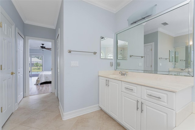 bathroom with ceiling fan, tile patterned flooring, vanity, and ornamental molding