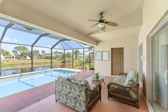 exterior space featuring a lanai, outdoor lounge area, ceiling fan, a water view, and a patio