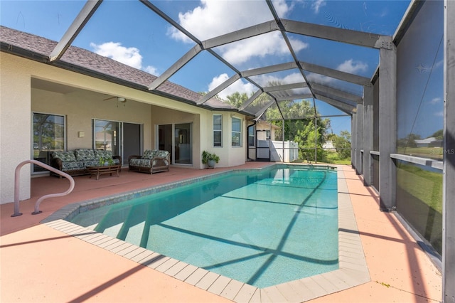 view of pool featuring a lanai, ceiling fan, and a patio