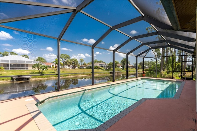 view of swimming pool with a lanai, a patio area, and a water view