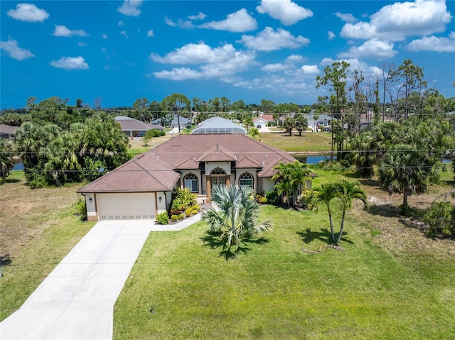 view of front of house featuring a front yard and a garage