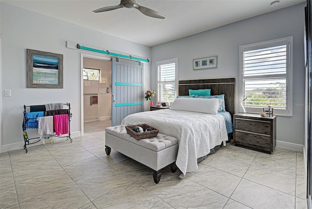 tiled bedroom featuring ensuite bath, ceiling fan, and multiple windows