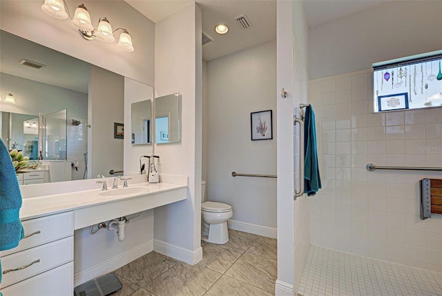 bathroom with oversized vanity, toilet, and tile flooring