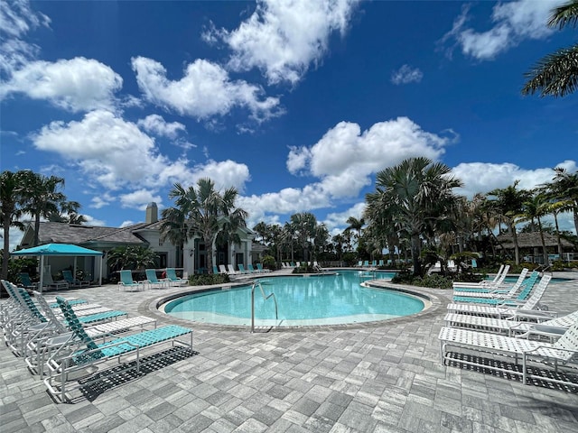 view of swimming pool featuring a patio area