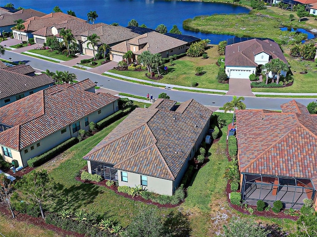 drone / aerial view with a water view