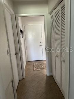 corridor featuring tile patterned floors