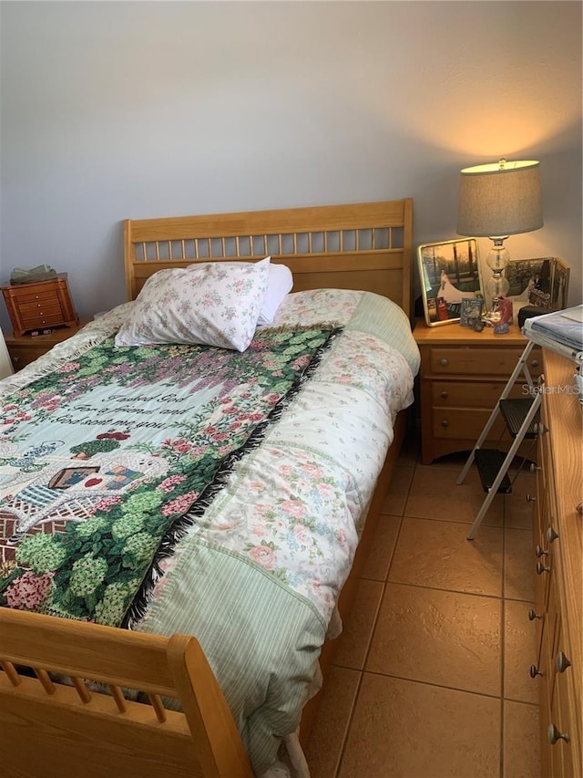 bedroom with light tile patterned flooring