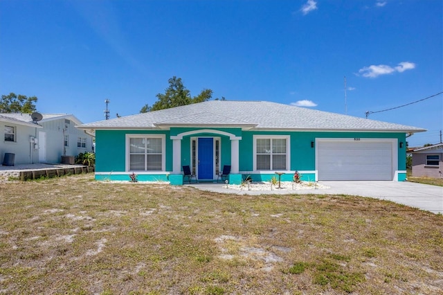 single story home with a front lawn, a garage, and a porch