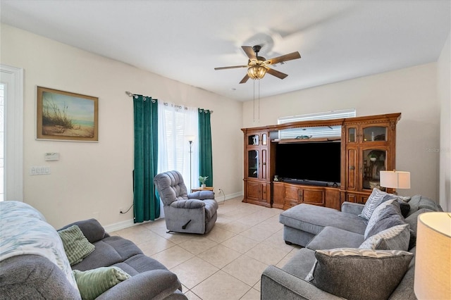 tiled living room with ceiling fan