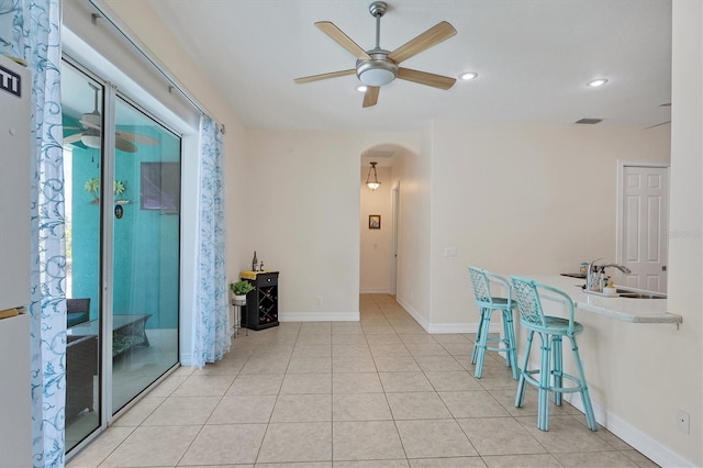 interior space featuring sink and light tile flooring