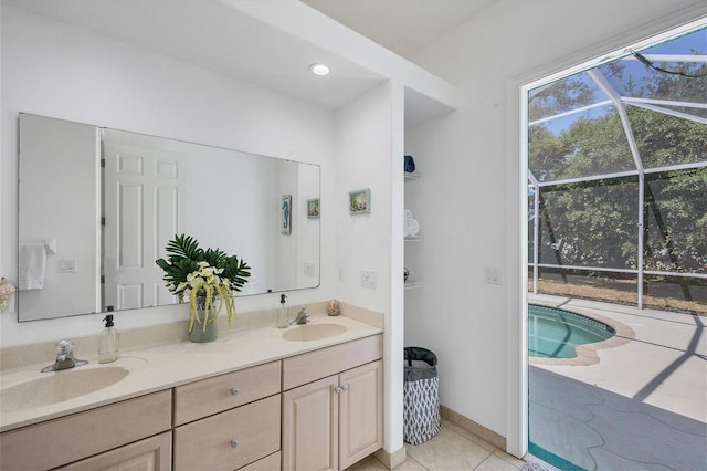 bathroom with dual bowl vanity and tile floors