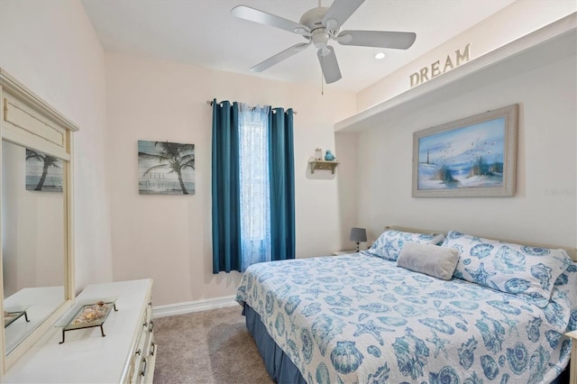 bedroom featuring ceiling fan and carpet