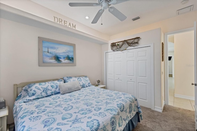 carpeted bedroom with a closet and ceiling fan