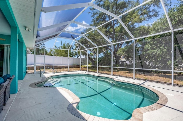 view of pool with a lanai and a patio area