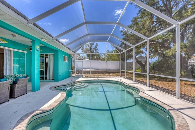 view of pool featuring a patio area and glass enclosure