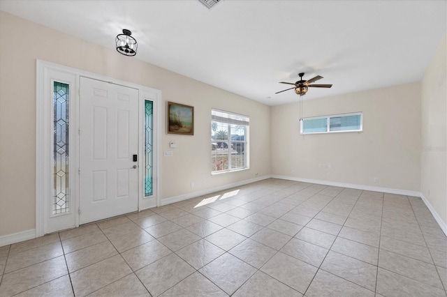 entrance foyer with light tile patterned floors and ceiling fan