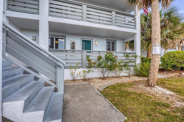 doorway to property featuring a balcony